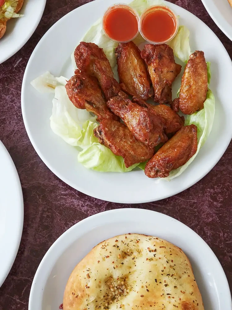 Pizza and wings party platter for group orders and catering at New Pizza Factory Edmonton
